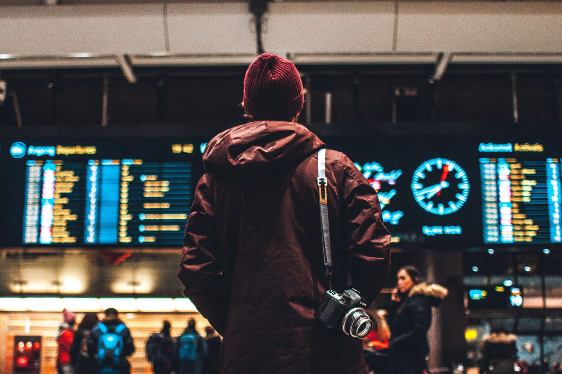 a man looking at flight schedule