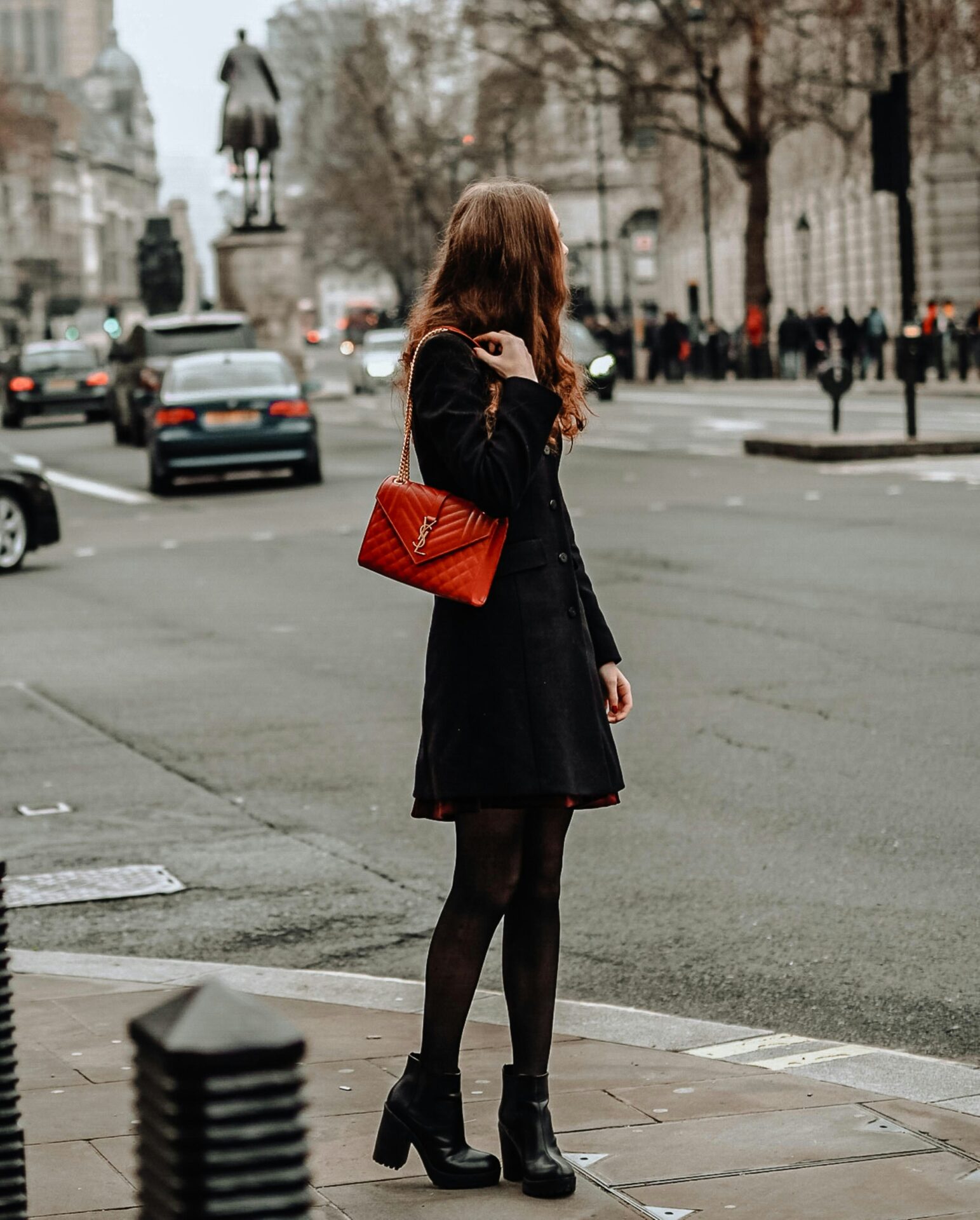 a lady with a red bag